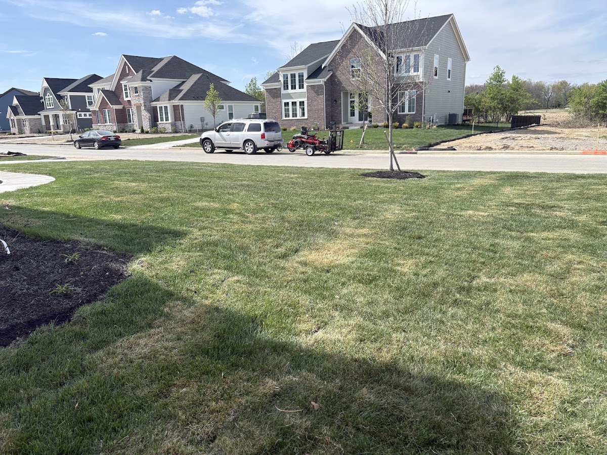 All Cutz LLC's mowing equipment on-site at a Columbus, Ohio property